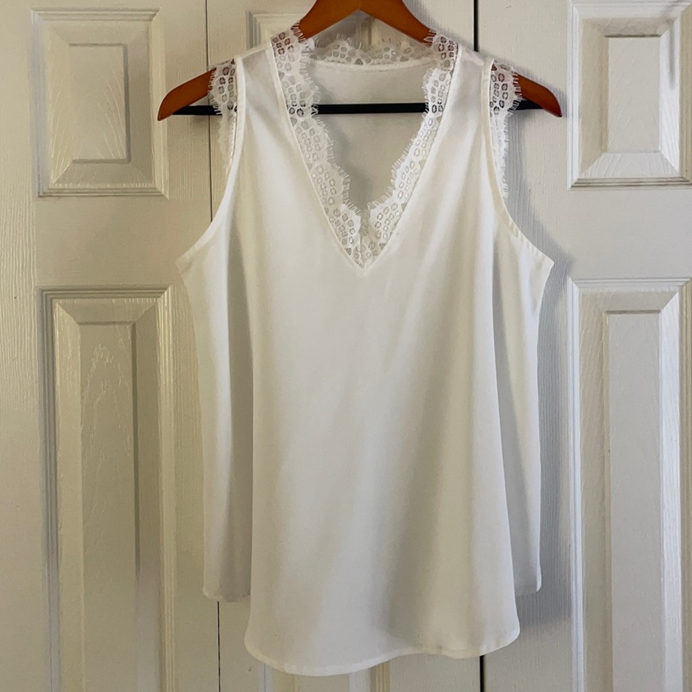 Flowy white top with eyelash lace trim